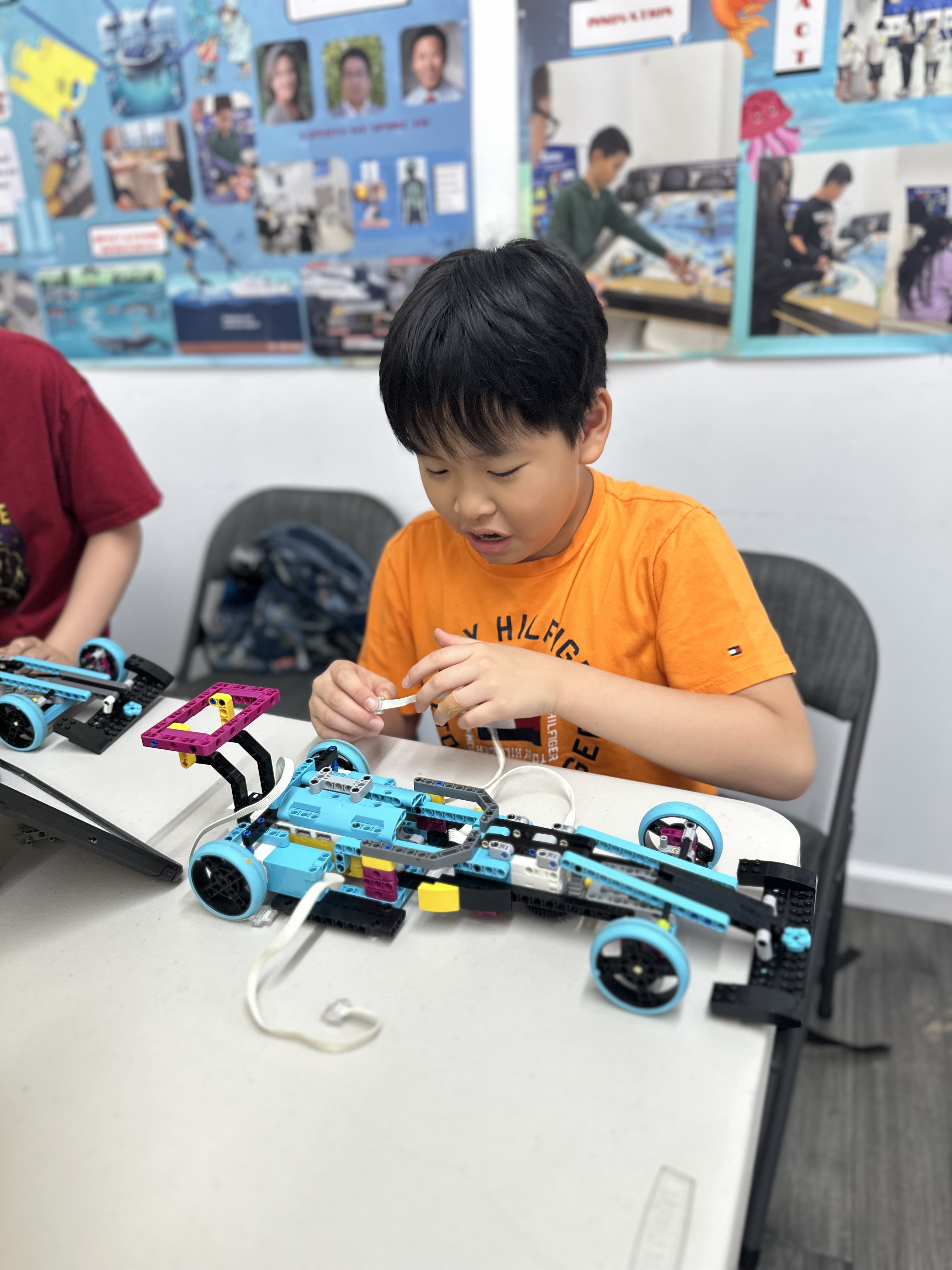 Students collaborating in robotics camp