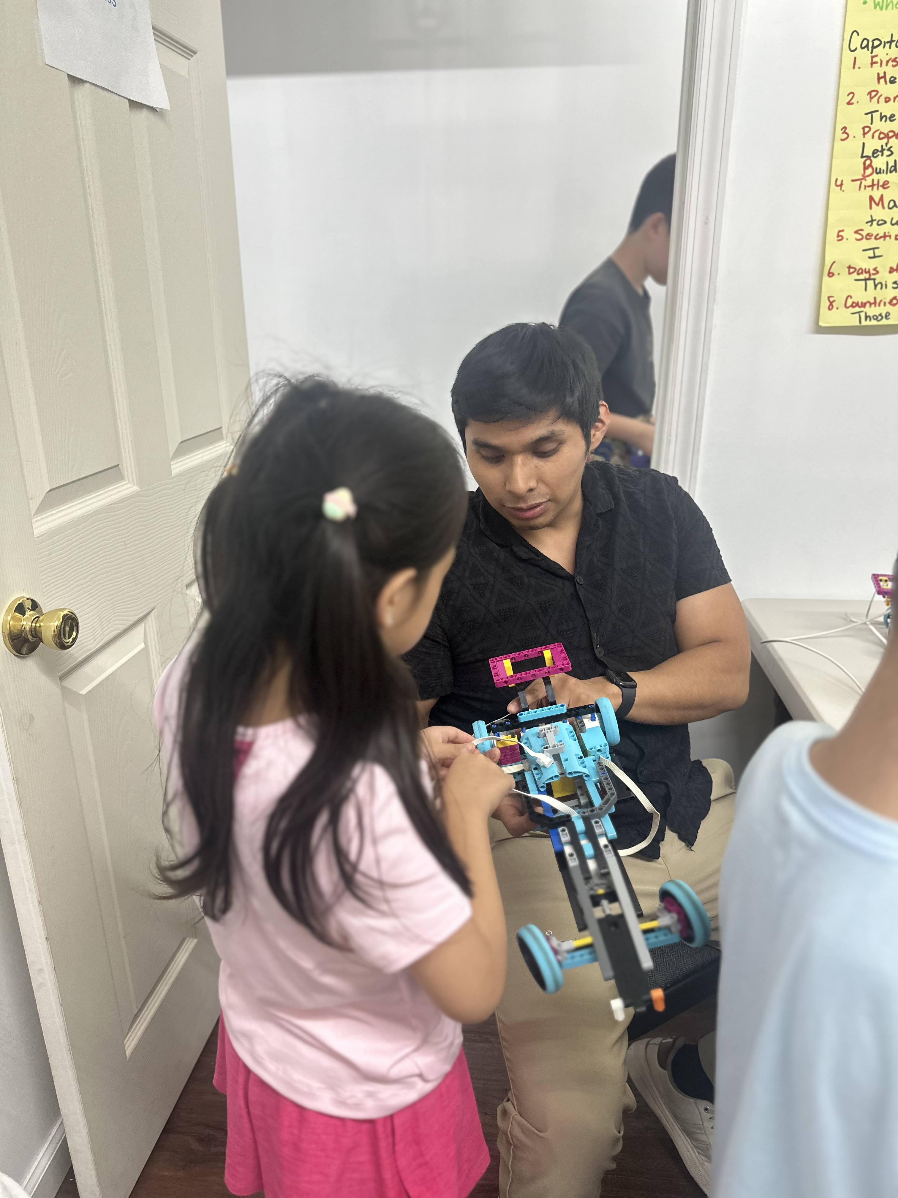 AI Future summer campers working together on a STEM activity
