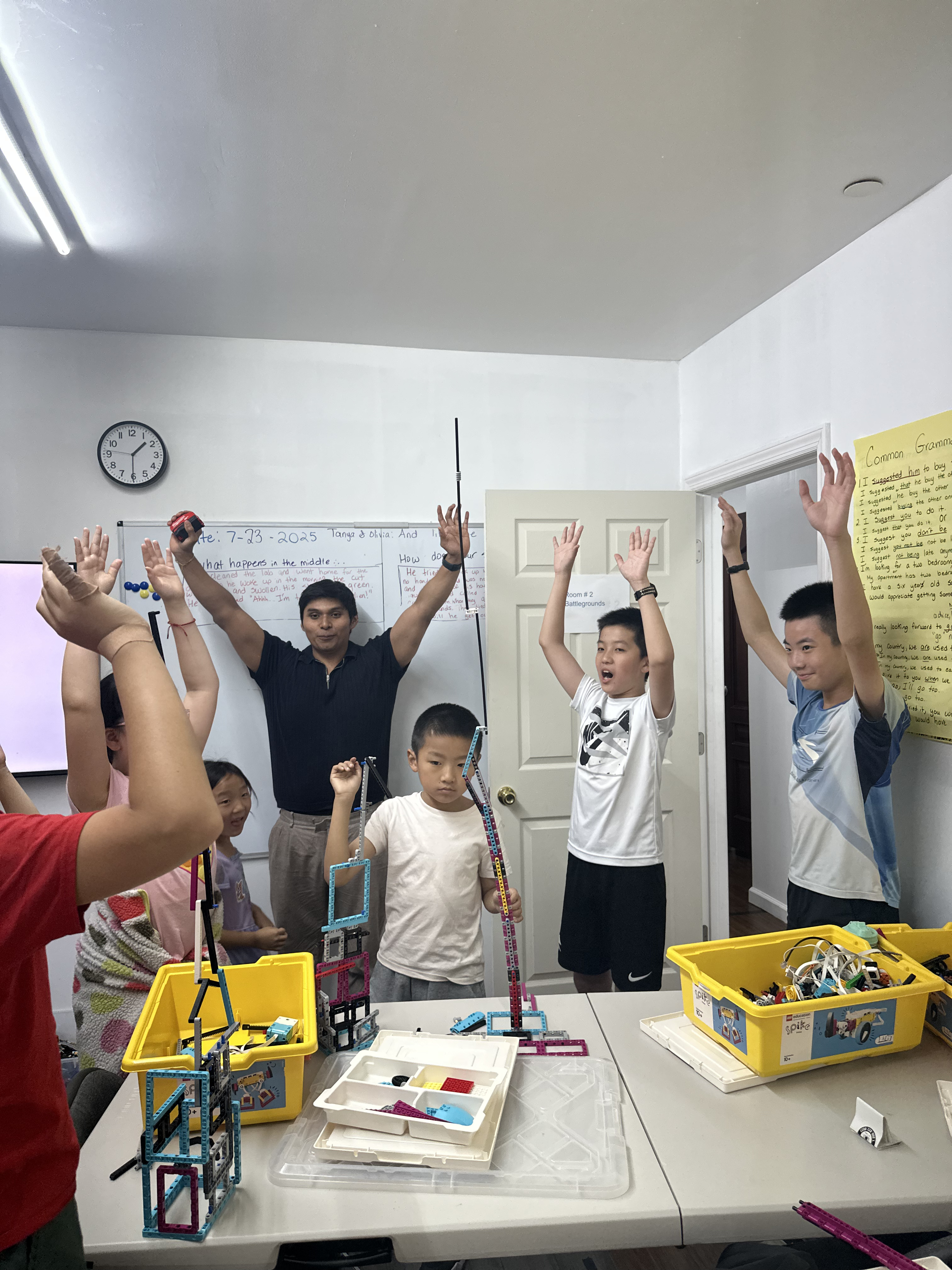 AI Future summer camp students collaborating on robotics and engineering challenges